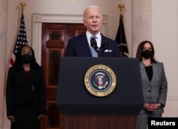 U.S. President Joe Biden is flanked by federal appellate judge Ketanji Brown Jackson and Vice President Kamala Harris as he announces Jackson as his nominee to be a U.S. Supreme Court Associate Justice, at the White House in Washington, Feb. 25, 2022.