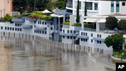 Floodwaters flow into an apartment building on the river in Brisbane, Australia, March 2, 2022