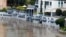 Floodwaters flow into an apartment building on the river in Brisbane, Australia, March 2, 2022