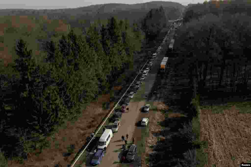 A screen grab from drone footage shows cars forming a line that stretches some 35 km from the Shehyni border crossing to Poland as people try to flee Russia&#39;s military operation against Ukraine, outside Mostyska, Ukraine, Feb. 26, 2022. 