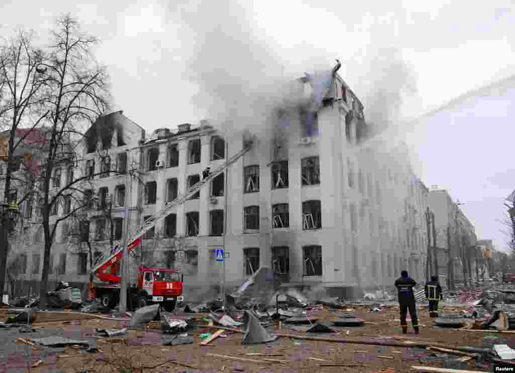 Firefighters extinguish a fire at the Kharkiv National University building, which city officials said was damaged by recent shelling, in Kharkiv, Ukraine, March 2, 2022. 