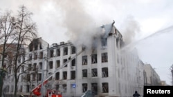 Firefighters extinguish a fire at the Kharkiv National University building, which city officials said was damaged by recent shelling, in Kharkiv, Ukraine, March 2, 2022. 