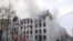 Firefighters extinguish a fire at the Kharkiv National University building, which city officials said was damaged by recent shelling, in Kharkiv, Ukraine, March 2, 2022. 