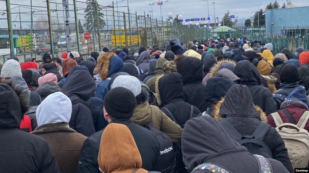 Some Zimbabweans students and Ukranians at the Poland border post after traveling hundreds of kilometers.