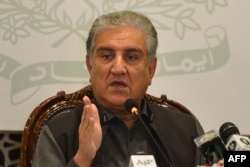 Pakistani Foreign Minister Shah Mehmood Qureshi gestures while addressing the members of the media in Islamabad, Feb. 25, 2022.