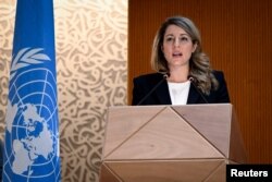 Canadian Foreign Minister Melanie Joly delivers a speech during a session of the U.N. Human Rights Council, following the Russian invasion in Ukraine, in Geneva, Switzerland, Feb. 28, 2022.