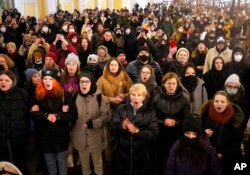 Demonstrators shout slogans in St. Petersburg, Russia, Feb. 25, 2022.