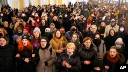 Demonstrators shout slogans in St. Petersburg, Russia, Friday, Feb. 25, 2022. Shocked Russians turned out by the thousands Thursday to decry their country's invasion of Ukraine as emotional calls for protests grew on social media. Some 1,745 people in 54 Russian cities were detained, at least 957 of them in Moscow. (AP Photo/Dmitri Lovetsky)