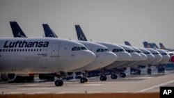 FILE - Picture taken June 3, 2020 shows Lufthansa aircrafts parking on a runway at the airport in Frankfurt, Germany.