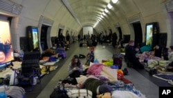 People gather in the Kyiv subway, using it as a bomb shelter, in Kyiv, March 2, 2022.
