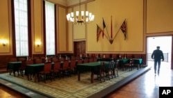 A man walks through the hall where a conditional surrender was signed at the German-Russian Museum in Berlin, May 8, 2014