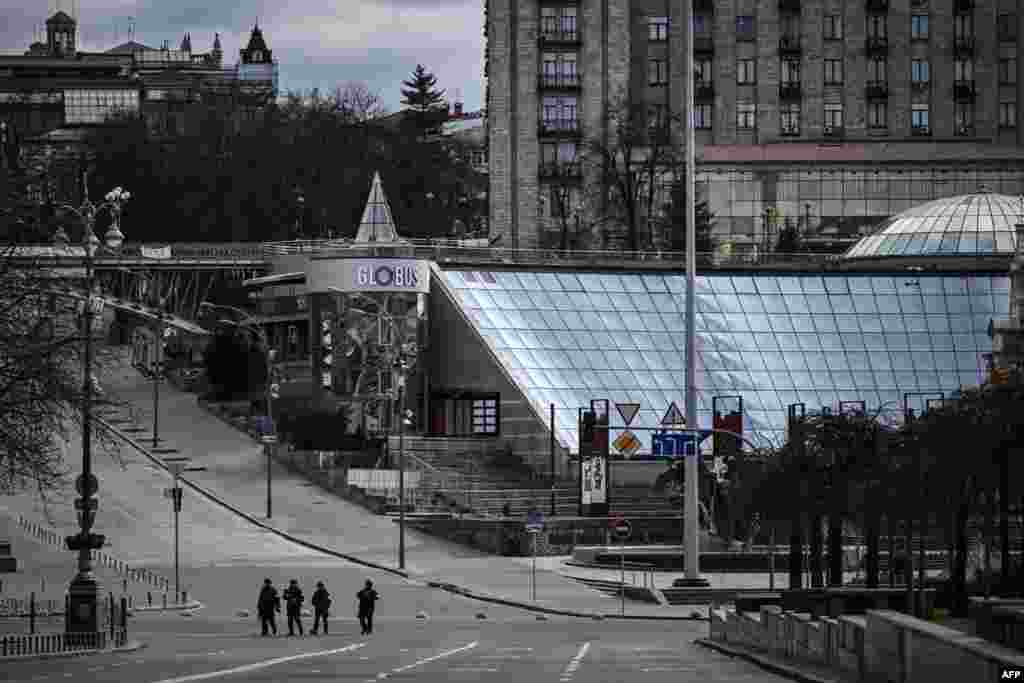 Members of Ukrainian forces patrol the streets at Maidan square in Kyiv, Feb. 27, 2022.