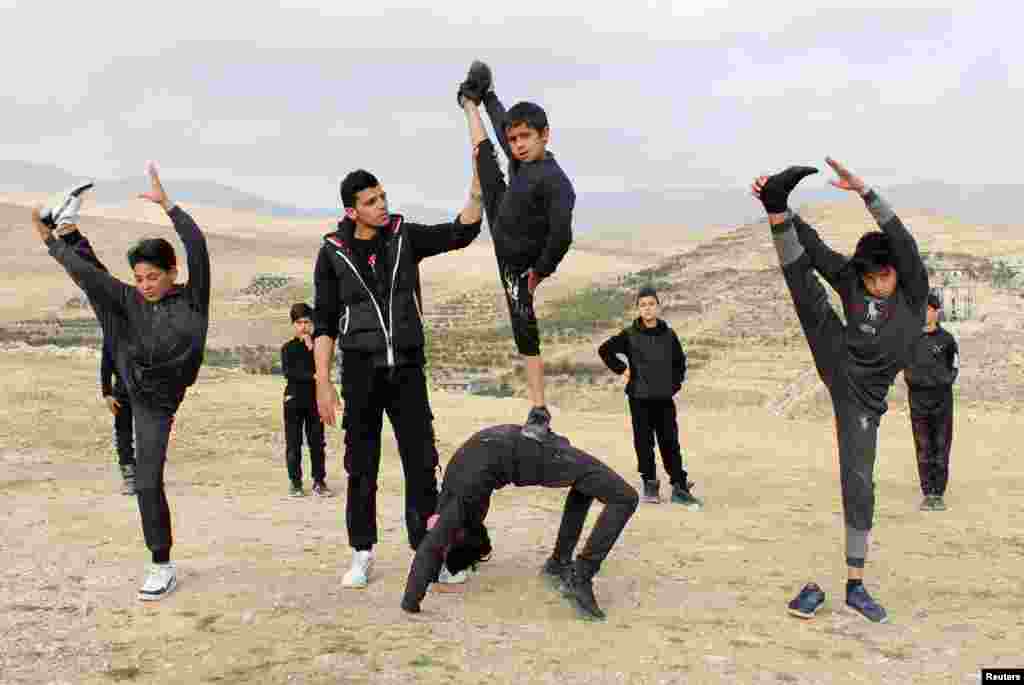 Boys take part in an open-air training session with Syrian martial arts Coach Hassan Mansour in Barada Valley, in Damascus suburb, Feb. 27, 2022.