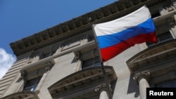 FILE - A Russian flag flies outside the Consulate General of the Russian Federation in New York in Manhattan, New York City, Aug. 2, 2021. 