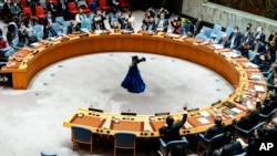 FILE - The U.N. Security Council votes on a resolution, Feb. 25, 2022, at U.N. headquarters.