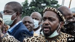 FILE: Newly elected Zulu monarch Prince Misuzulu Zulu (R) arrives to attend the provincial memorial service at the Khangelakamankegane Royal Palace in Nongoma on May 7, 2021.