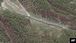 This satellite image provided by Maxar Technologies shows the northern end of a convoy at the southeast of Ivankiv, north west of Kyiv, Ukraine, Feb. 28, 2022.