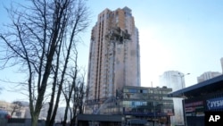 An apartment building is seen damaged following a rocket attack on the city of Kyiv, Ukraine, Feb. 26, 2022.
