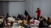 African students who studied in Ukraine are seen in temporary accomodations in a sports hall in Przemysl, eastern Poland, Feb. 28, 2022. Seventeen students from Ghana managed to make it back to their home country Tuesday. 