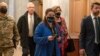 Ukrainian Ambassador Oksana Markarova, center, walks to a meeting with the Senate Ukraine Caucus, at the Capitol in Washington, Feb. 28, 2022.