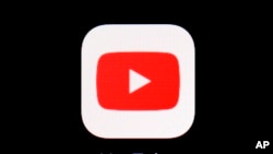FILE - The YouTube app is shown on an iPad on March 20, 2018.