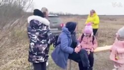 Ukrainian Mothers Hug and Cry as Children Handed Over at Border 