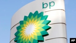 FILE - A view of the BP logo at a gasoline station in London, Aug. 1, 2017. 