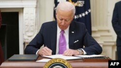 Joe Biden signing executive orders 
