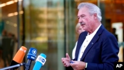 FILE - Luxembourg's Foreign Minister Jean Asselborn speaks with reporters during arrivals for a meeting of EU foreign ministers at the Brdo Congress Center in Kranj, Slovenia, Sept. 2, 2021.