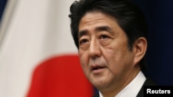Japan's new Prime Minister Shinzo Abe attends a news conference at his official residence in Tokyo, December 26, 2012.