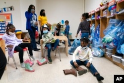 Pre-K students start the school day at Phyl's Academy, March 24, 2021, in the Brooklyn borough of New York.