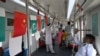 FILE - Passengers ride in an Orange Line Metro Train, a metro project planned under the China-Pakistan Economic Corridor, Oct. 26, 2020. Russia, Venezuela and Pakistan are the top three recipients of Chinese development funding in the past two decades.