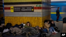 People sleep in the Kyiv subway, using it as a bomb shelter in Kyiv, Ukraine, Feb. 25, 2022.