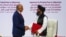 Mullah Abdul Ghani Baradar, Taliban delegation leader, and Zalmay Khalilzad, U.S. envoy for peace in Afghanistan, shake hands after signing an agreement between members of Afghanistan's Taliban and the U.S. in Doha, Qatar, Feb. 29, 2020.