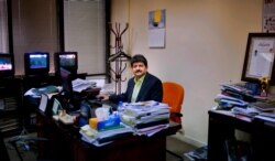 FILE PHOTO - In this photo taken on March 14, 2017, Pakistani journalist Hamid Mir sits in his office in Islamabad, Pakistan.