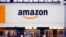 The Amazon logo is seen at the company's logistics center in Bretigny-sur-Orge, near Paris, France, Dec. 7, 2021. 
