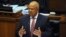 FILE - South African Finance Minister Pravin Gordhan delivers his 2013 Budget speech at Parliament in Cape Town, Feb. 27, 2013. 
