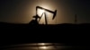 FILE photo - A pump jack is seen at sunrise. The United States and large energy-consuming countries in Europe have not sanctioned Russian oil, but prices have spiked since the Russian invasion of Ukraine.