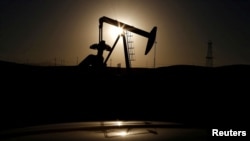 FILE photo - A pump jack is seen at sunrise. The United States and large energy-consuming countries in Europe have not sanctioned Russian oil, but prices have spiked since the Russian invasion of Ukraine.