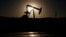 FILE photo - A pump jack is seen at sunrise. The United States and large energy-consuming countries in Europe have not sanctioned Russian oil, but prices have spiked since the Russian invasion of Ukraine.