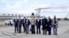 Taiwan's Foreign Minister Joseph Wu, fourth from right, stands with an American delegation including former Chairman of the Joint Chiefs Adm. Mike Mullen, third from right, as they arrive at Taipei Songshan Airport in Taipei, Taiwan, Tuesday, March 1, 2022.