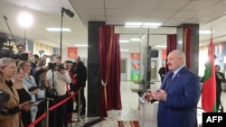 Belarus' President Alexander Lukashenko casts his ballot in the referendum on the constitutional amendments at a polling station in Minsk, Feb. 27, 2022.