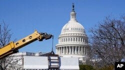 A barrier is placed behind a security fence in preparation for President Joe Biden's State of the Union address on Capitol Hill in Washington, Feb. 27, 2022.