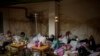 Sick children and women with their newborn babies stand at a basement used as a bomb shelter at the Okhmadet children's hospital in central Kyiv, Ukraine, March 1. 2022. 