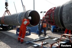 Pekerja terlihat di lokasi pembangunan pipa gas Nord Stream 2, dekat kota Kingisepp, wilayah Leningrad, Rusia, 5 Juni 2019. (Foto: REUTERS/Anton Vaganov)