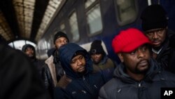 FILE - African residents in Ukraine wait at the platform inside Lviv railway station, Feb. 27, 2022, in Lviv, west Ukraine.