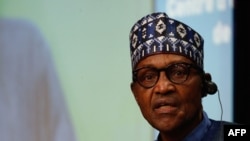 FILE - Nigeria's President Muhammadu Buhari speaks at the European Union-African Union summit in Brussels on Feb. 18, 2022. Following violent protests over a shortage of cash, Buhari extended until April 10, 2023, the deadline for older currency notes to remain legal tender.