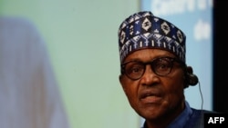 Nigeria's President Muhammadu Buhari delivers a speech during a meeting of a European Union (EU) African Union (AU) summit in Brussels on Feb. 18, 2022. 