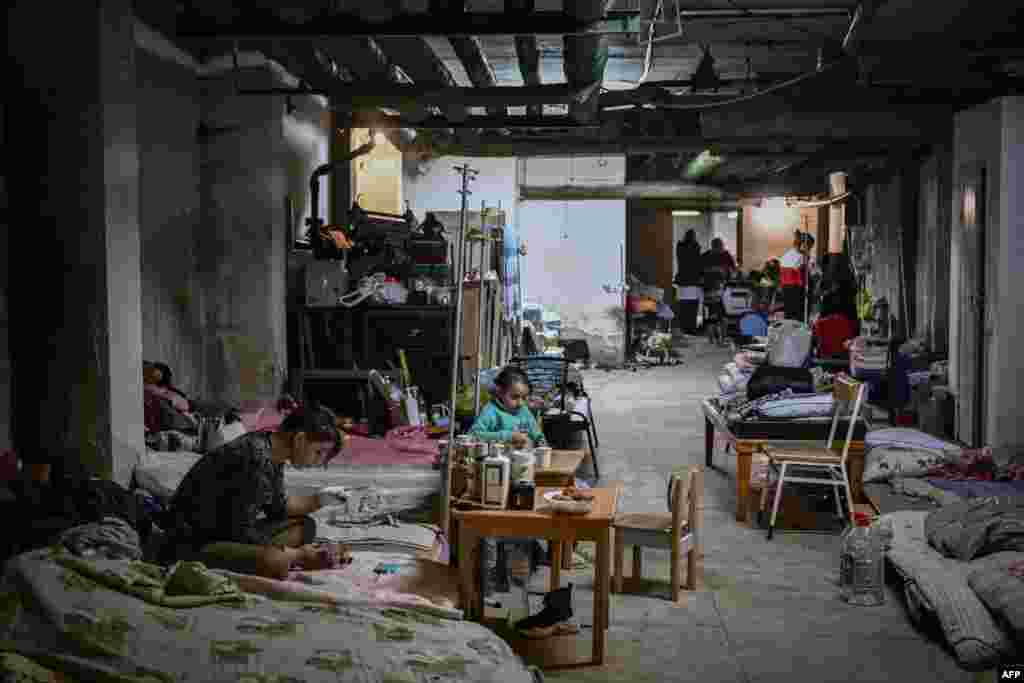 Children being treated at a hospital have their beds placed in the basement of the hospital,which is being used as a bomb shelter, in Kyiv, Ukraine.