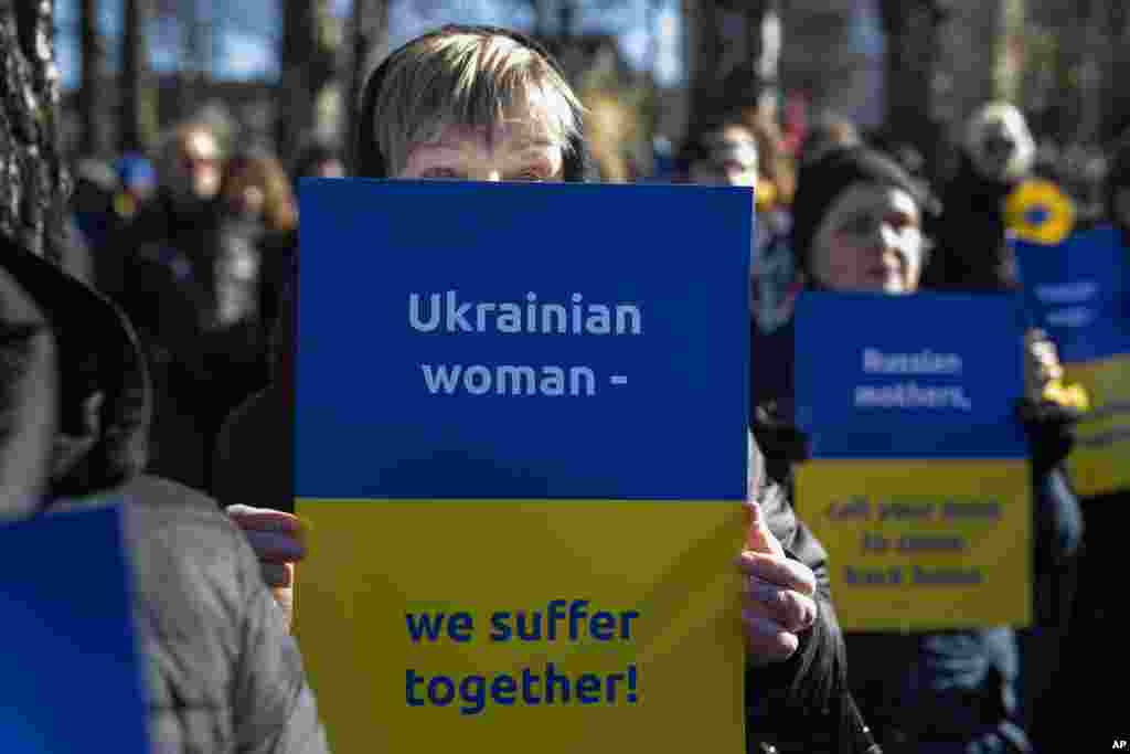 Members of the anti-war organization &quot;Women in Black&quot; take part in a protest against the Russian invasion of Ukraine, in front of the Russian embassy in Vilnius, Lithuania, Feb. 27, 2022.